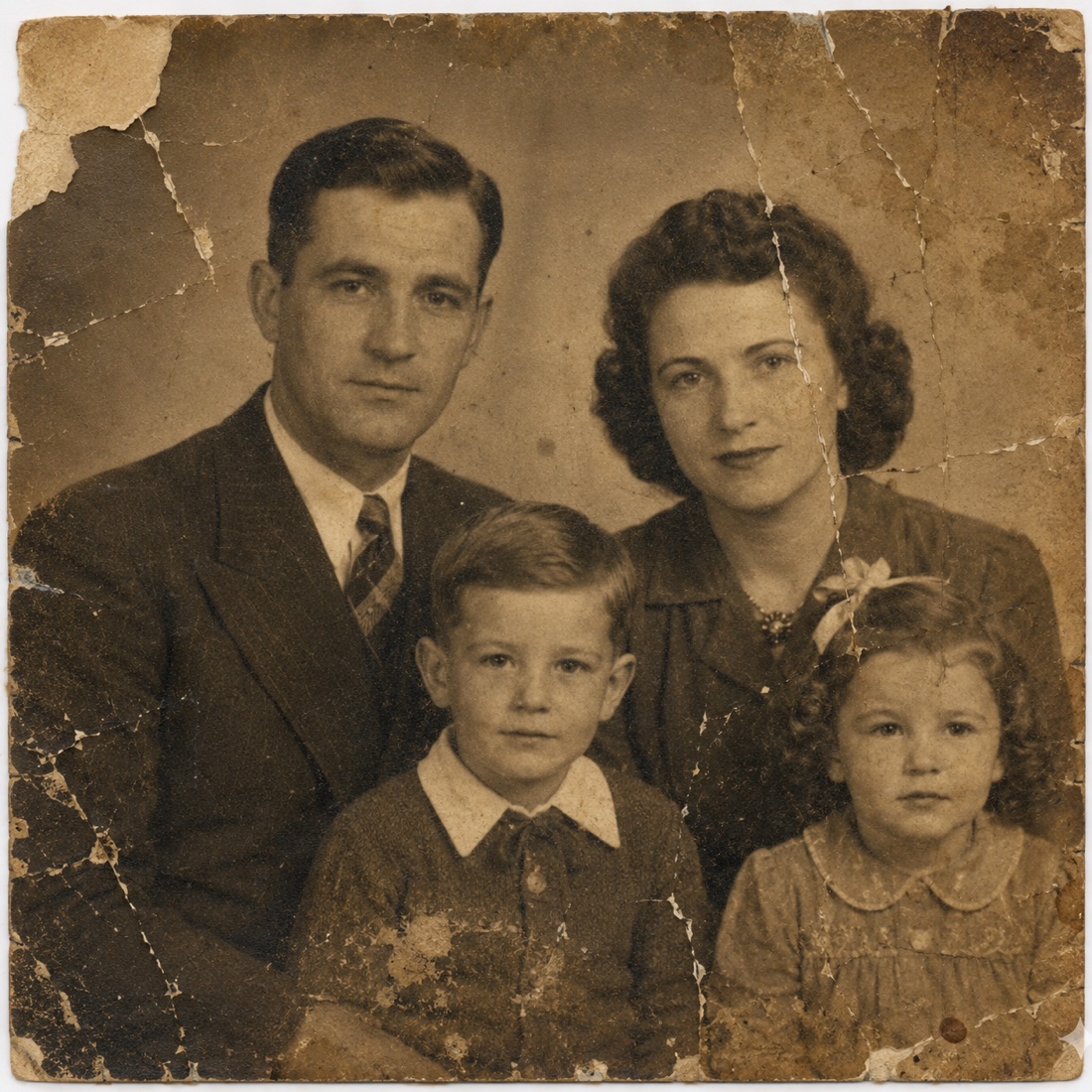 Original faded and damaged family portrait